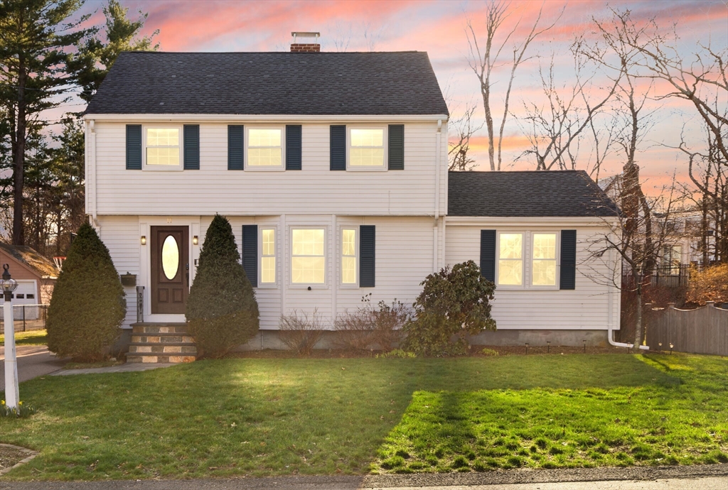 11 Hoover Road Walpole, MA 02081 - Photo 1 of 39 a front view of a house with garden