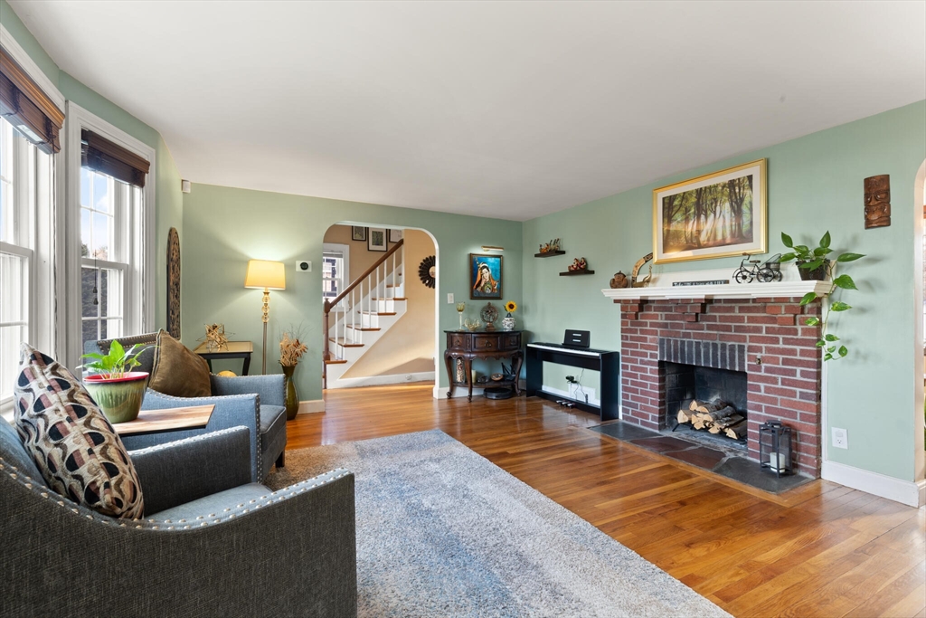 11 Hoover Road Walpole, MA 02081 - Photo 11 of 39 a living room with furniture and a fireplace