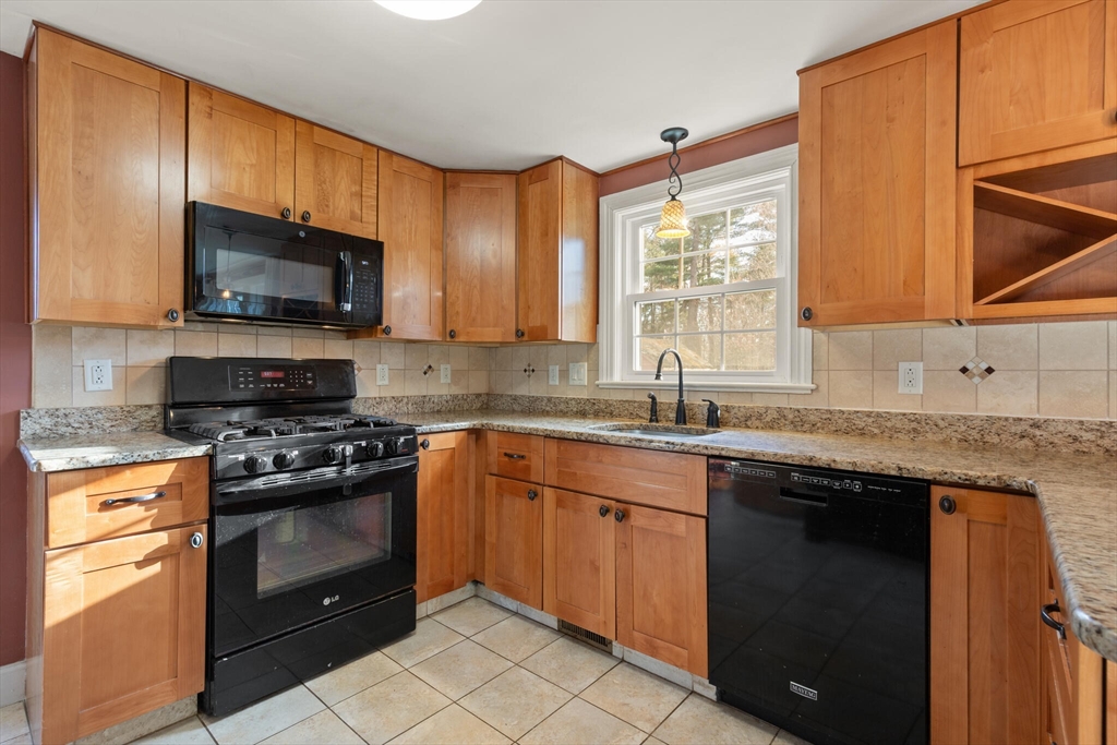 11 Hoover Road Walpole, MA 02081 - Photo 18 of 39 a kitchen with granite countertop a stove sink and microwave