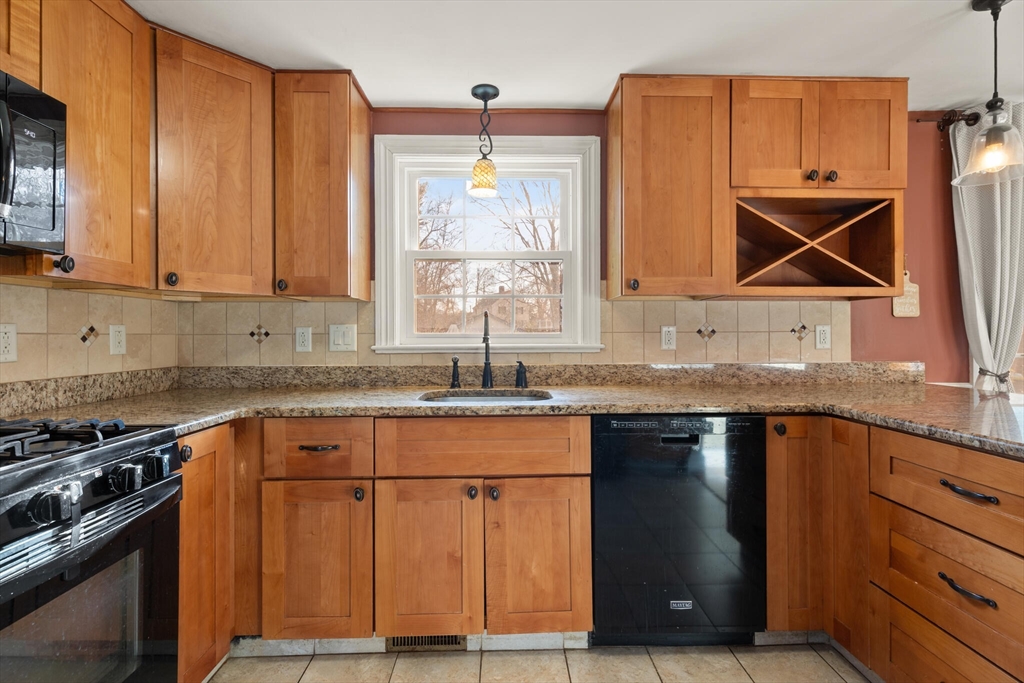 11 Hoover Road Walpole, MA 02081 - Photo 20 of 39 a kitchen with granite countertop a sink stove and cabinets