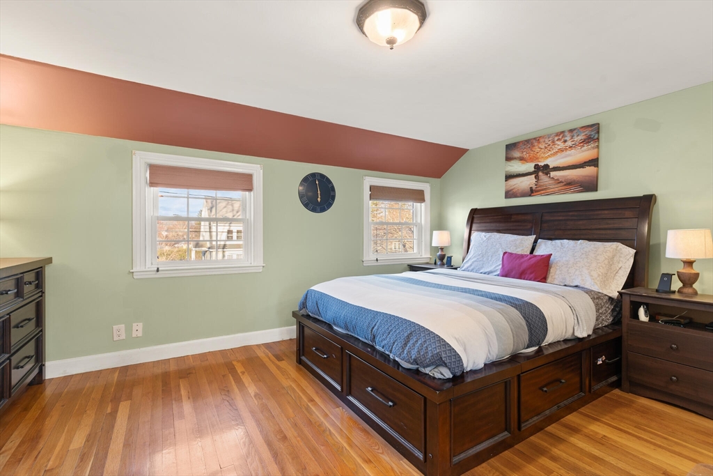 11 Hoover Road Walpole, MA 02081 - Photo 24 of 39 a bedroom with a bed and wooden floor
