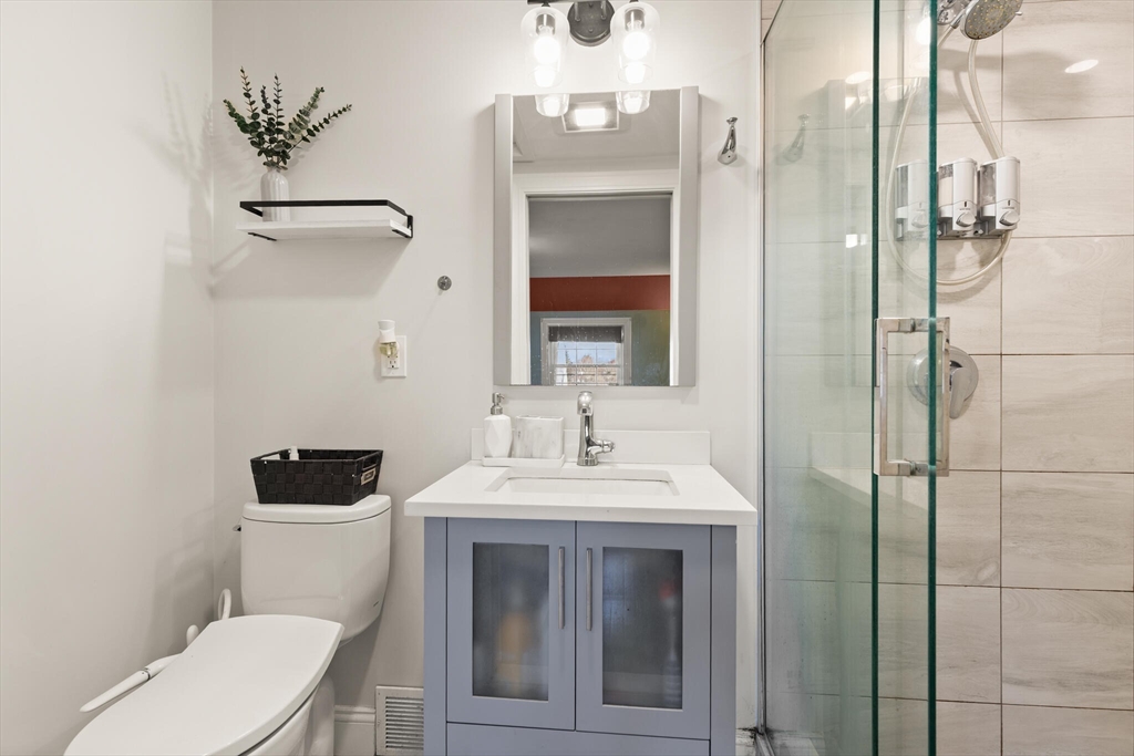 11 Hoover Road Walpole, MA 02081 - Photo 26 of 39 a bathroom with a toilet sink and shower