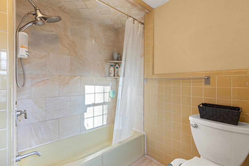 11 Hoover Road Walpole, MA 02081 - Photo 28 of 39 a bathroom with a toilet a bath tub and a shower