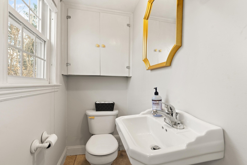 11 Hoover Road Walpole, MA 02081 - Photo 29 of 39 a bathroom with a toilet a sink and mirror