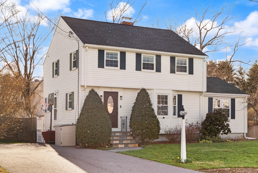 11 Hoover Road Walpole, MA 02081 - Photo 4 of 39 a front view of a house with a yard and an outdoor seating
