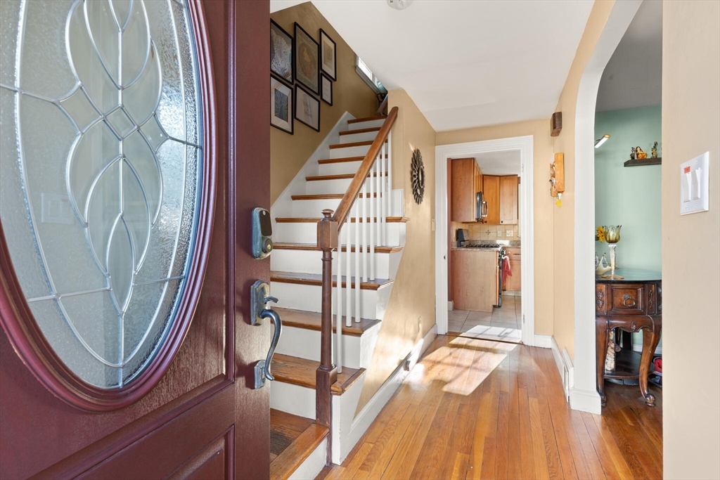 11 Hoover Road Walpole, MA 02081 - Photo 6 of 39 a view of a hallway with wooden floor and entryway