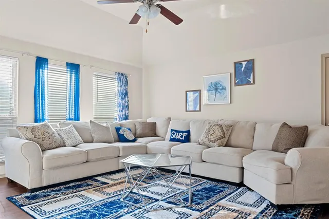 a living room with furniture and a rug