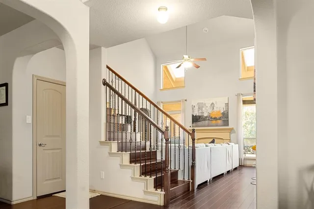a view of entryway and hall with wooden floor