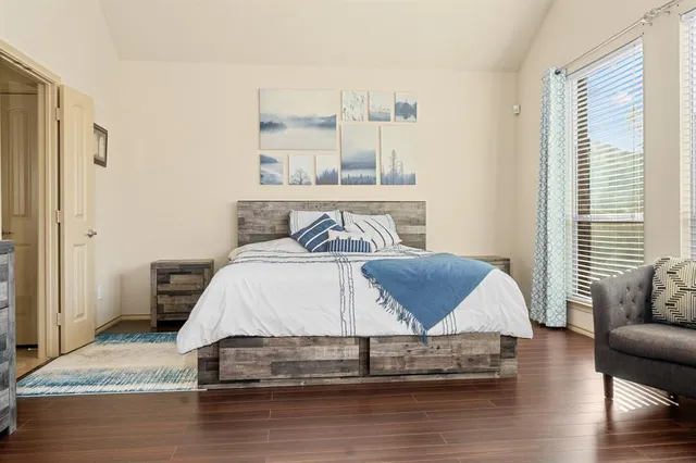 a living room with a bed furniture and a window