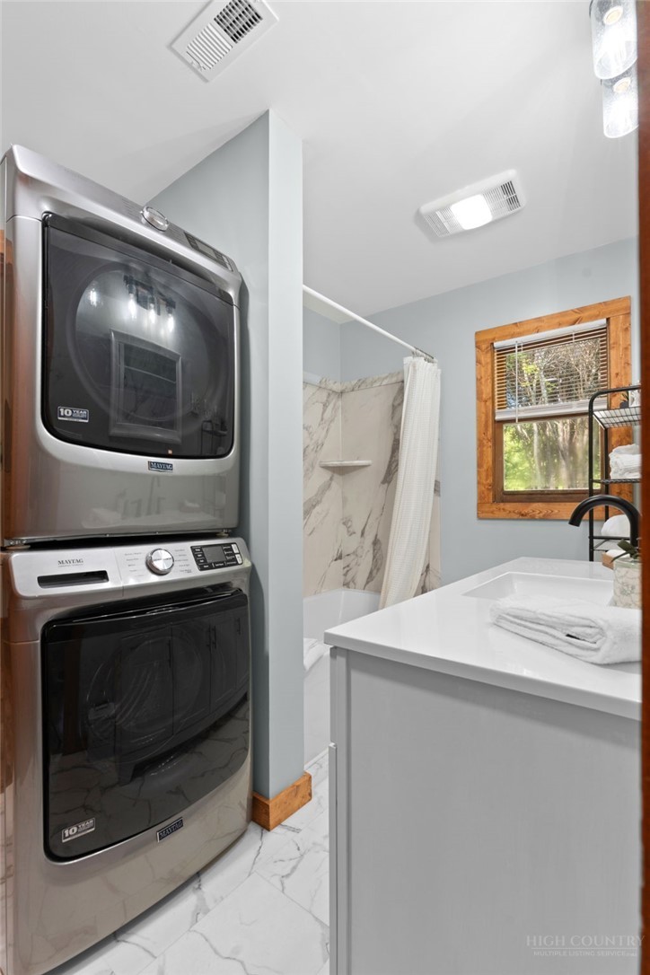 139 Golden Rod Loop Newland, NC 28657 - Photo 19 of 39 a utility room with dryer and washer