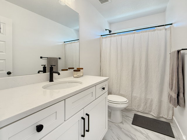 641 Desert Willow Drive Mapleton, UT 84664 - Photo 34 of 41 Full bathroom with vanity and light marble finish flooring