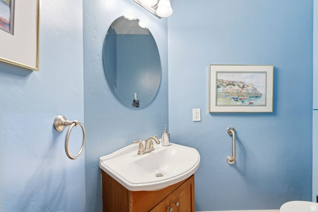 7235 Viansa Court Midvale, UT 84047 - Photo 28 of 43 Bathroom featuring vanity and a textured wall