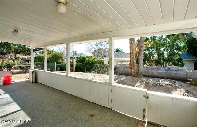 a view of a house with snow on the background