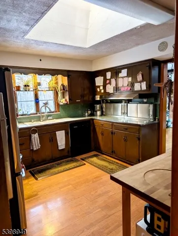 a kitchen view with a sink and window