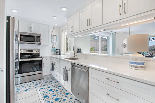 a kitchen with a stove microwave and refrigerator