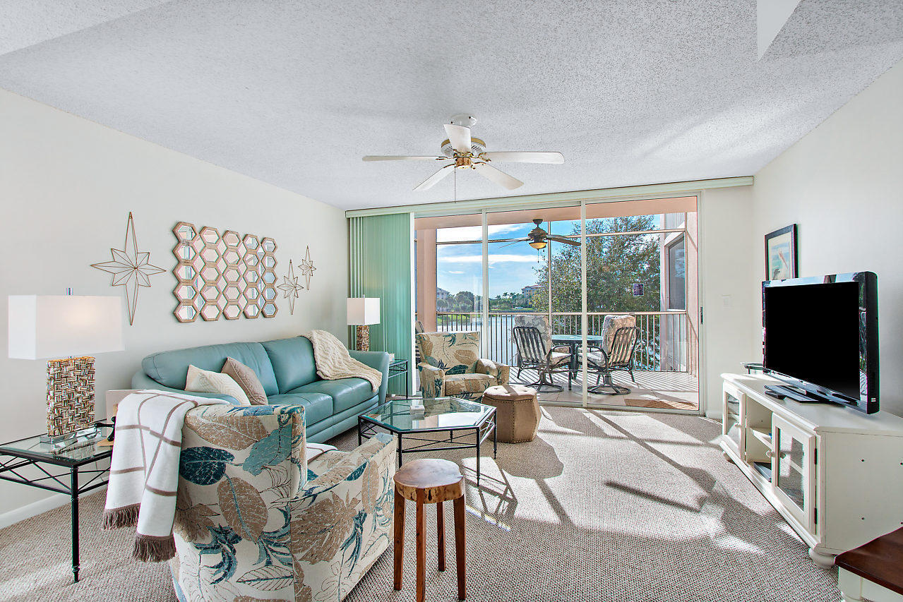 353 Highway 1, Unit B301 Jupiter, FL 33477 - Photo 17 of 58 a living room with furniture a flat screen tv and a large window