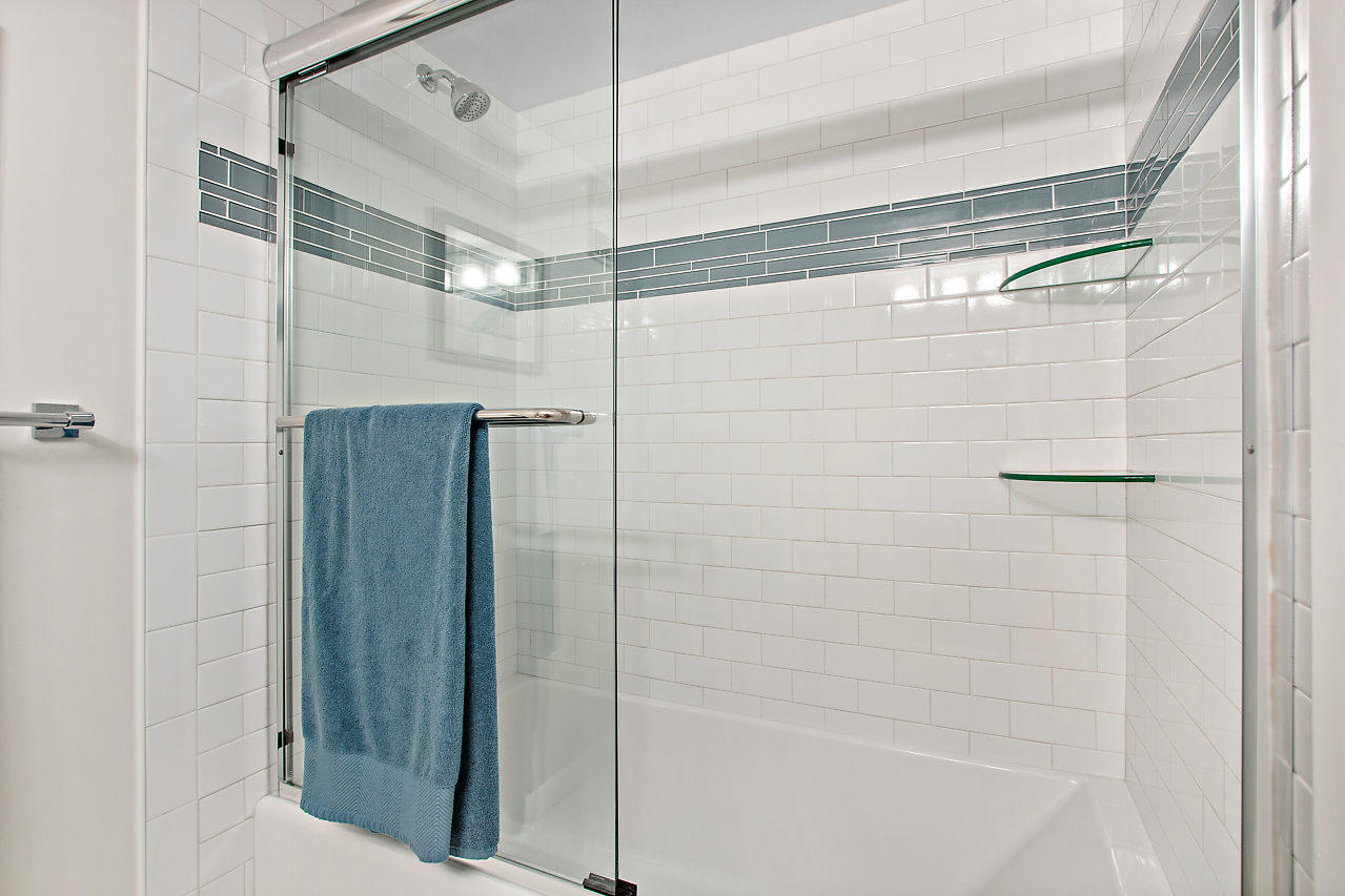 353 Highway 1, Unit B301 Jupiter, FL 33477 - Photo 28 of 58 a bathroom with a shower and a glass door