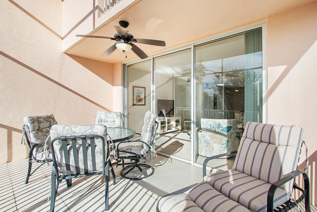 353 Highway 1, Unit B301 Jupiter, FL 33477 - Photo 31 of 58 a view of a patio with couches chairs potted plants and wooden floor