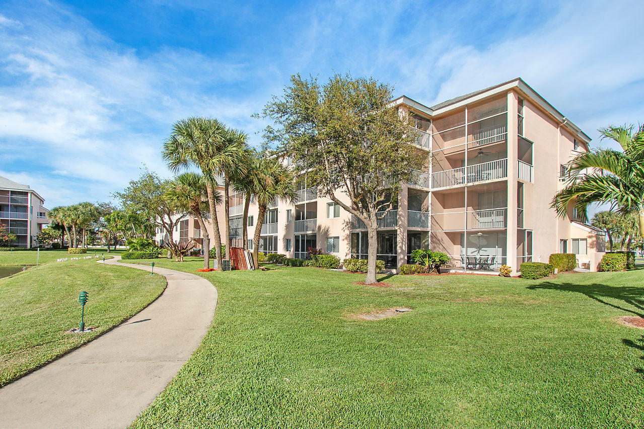 353 Highway 1, Unit B301 Jupiter, FL 33477 - Photo 34 of 58 a front view of a building with a garden