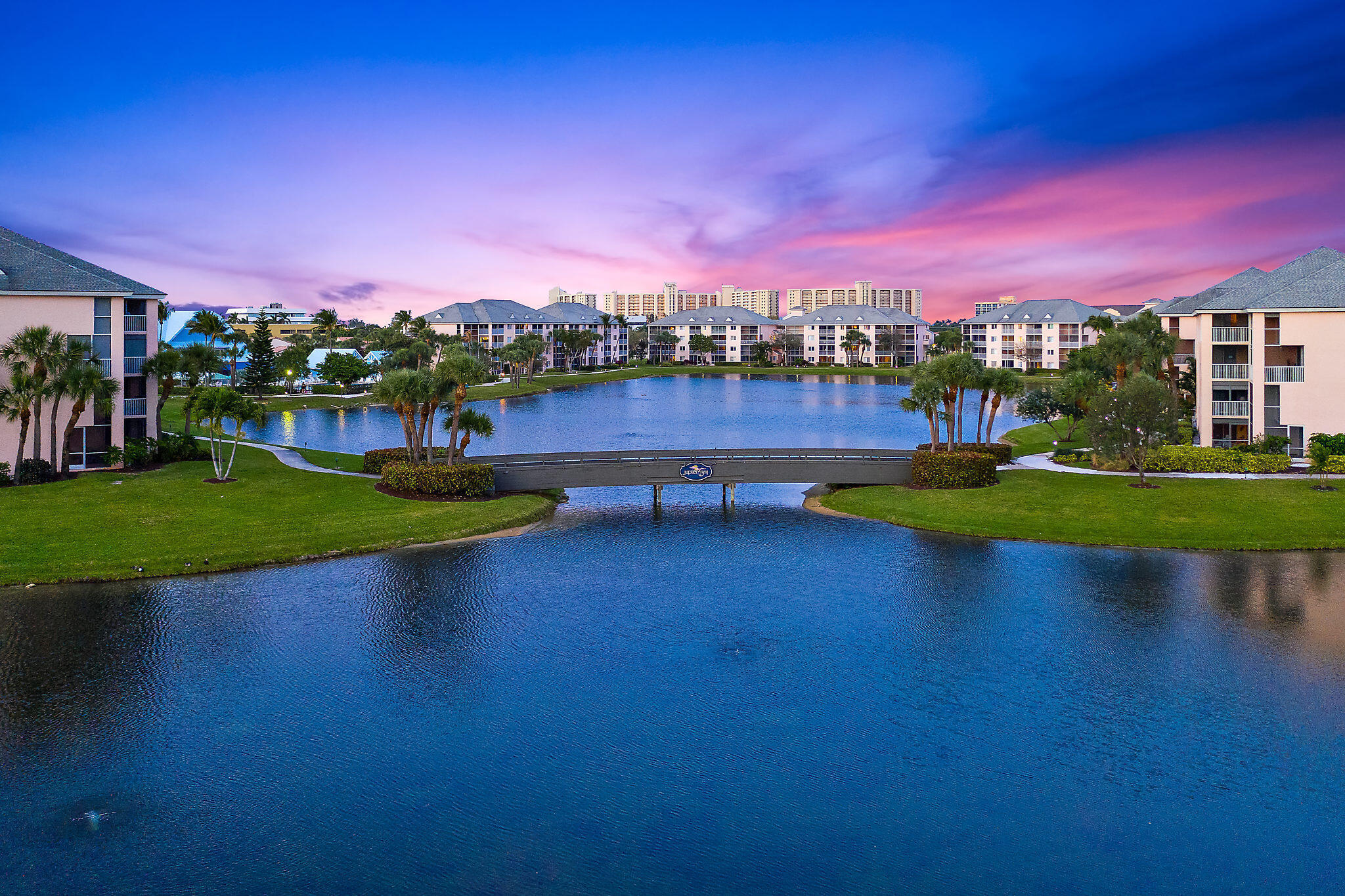 353 Highway 1, Unit B301 Jupiter, FL 33477 - Photo 39 of 58 a view of a lake with houses in the background