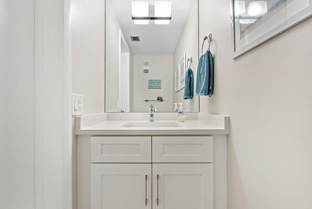 353 Highway 1, Unit B301 Jupiter, FL 33477 - Photo 10 of 58 a bathroom with a sink and a mirror