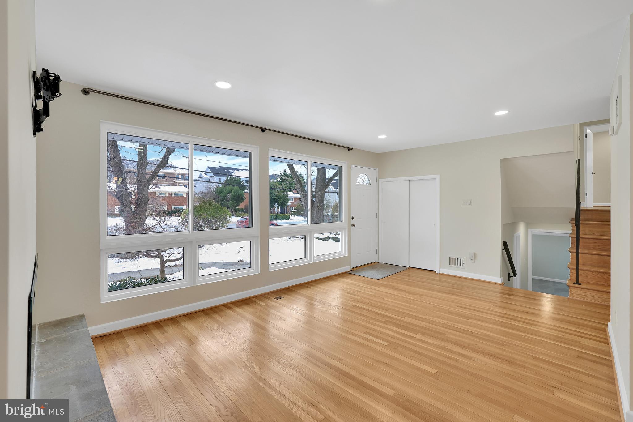 6718 Old Chesterbrook Road McLean, VA 22101 - Photo 13 of 49 a view of an empty room with wooden floor and a window