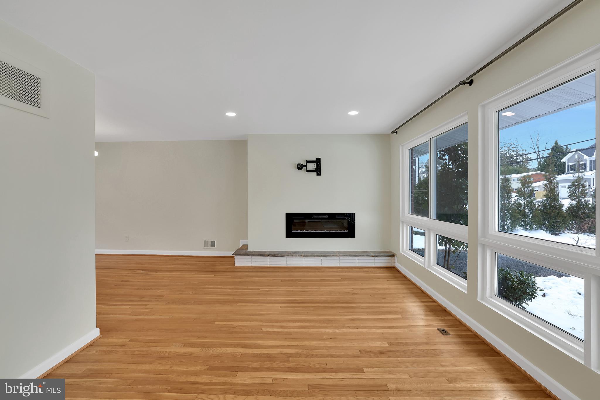 6718 Old Chesterbrook Road McLean, VA 22101 - Photo 15 of 49 a view of empty room with a fireplace and windows