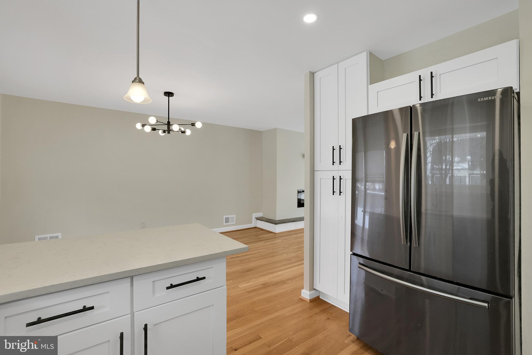 6718 Old Chesterbrook Road McLean, VA 22101 - Photo 23 of 49 a metallic refrigerator freezer sitting in a kitchen