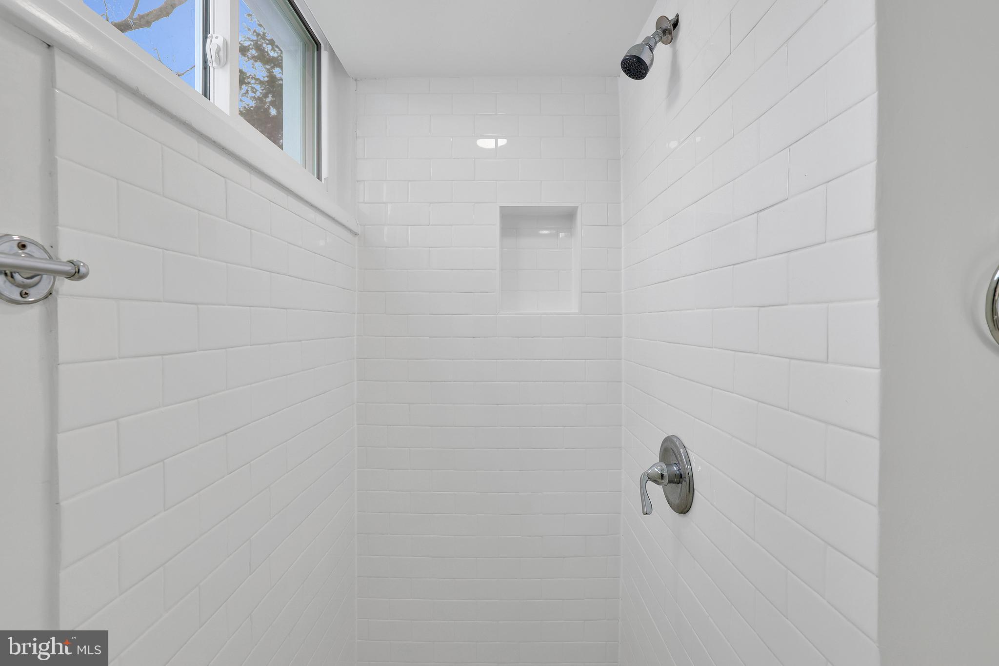 6718 Old Chesterbrook Road McLean, VA 22101 - Photo 26 of 49 a bathroom with a shower and a shower