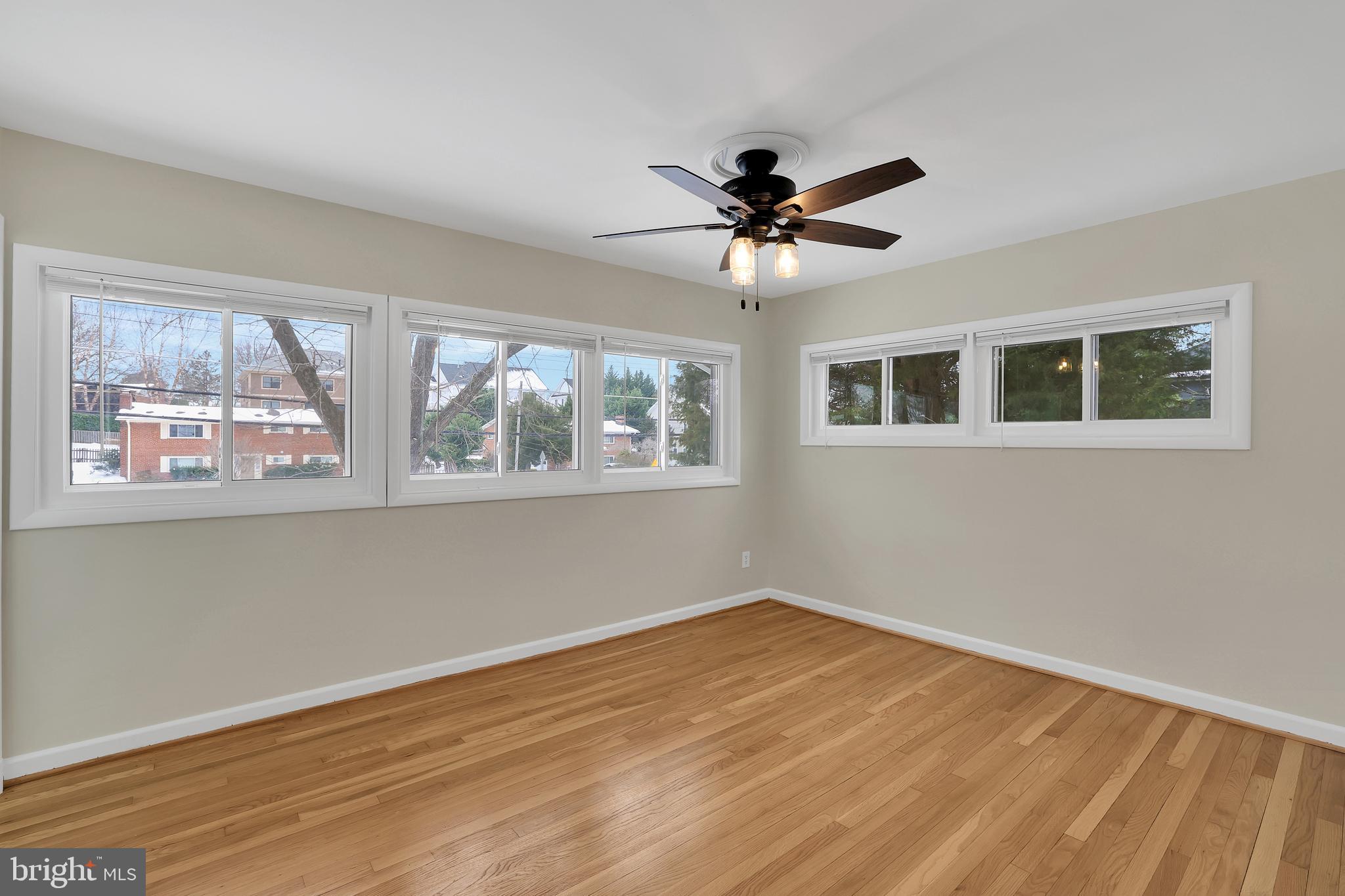6718 Old Chesterbrook Road McLean, VA 22101 - Photo 4 of 49 a view of empty room with wooden floor and fan