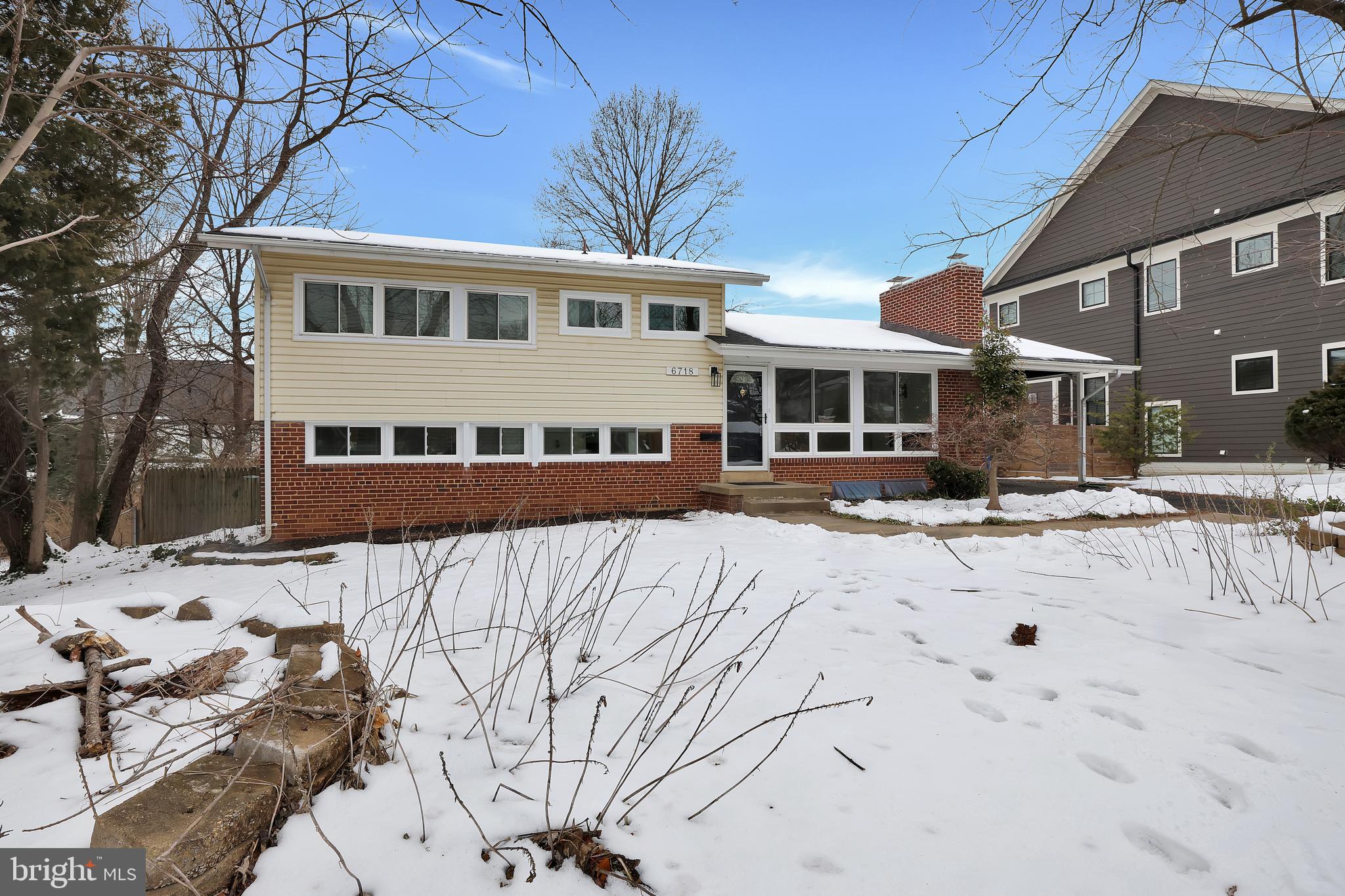 6718 Old Chesterbrook Road McLean, VA 22101 - Photo 45 of 49 a view of a house with snow on the road