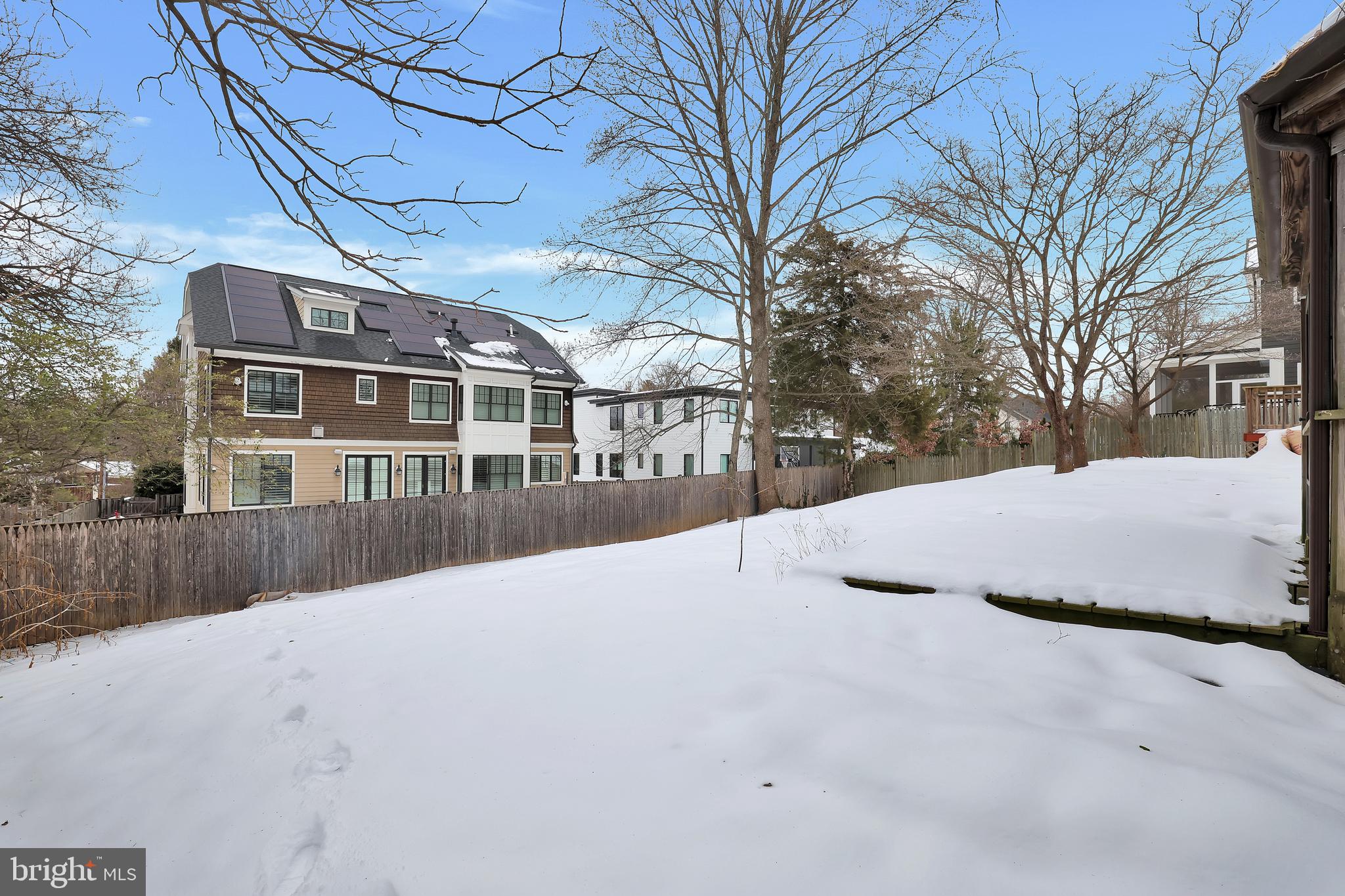 6718 Old Chesterbrook Road McLean, VA 22101 - Photo 48 of 49 a view of residential house with a yard covered in snow