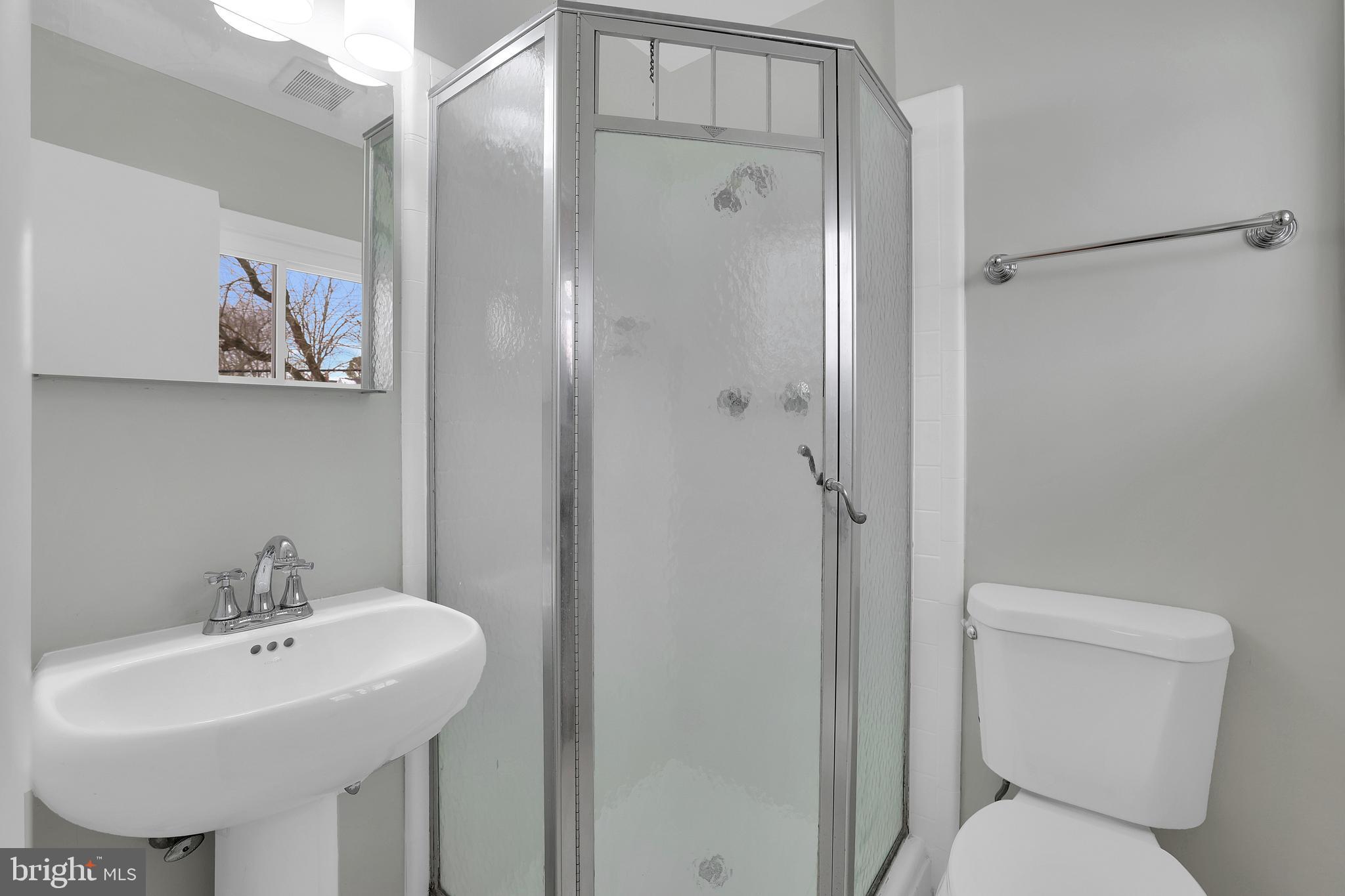 6718 Old Chesterbrook Road McLean, VA 22101 - Photo 6 of 49 a bathroom with a toilet sink and mirror