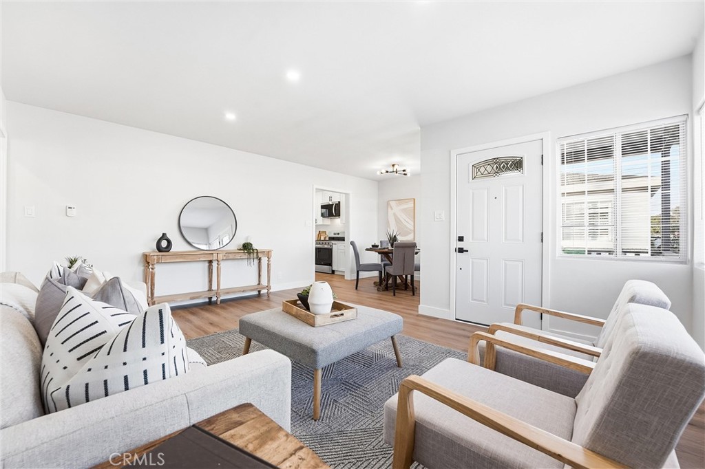 2835 Delta Avenue Long Beach, CA 90810 - Photo 5 of 29 a living room with furniture a window and wooden floor