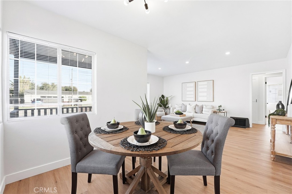 2835 Delta Avenue Long Beach, CA 90810 - Photo 7 of 29 a view of a dining room with furniture window and wooden floor