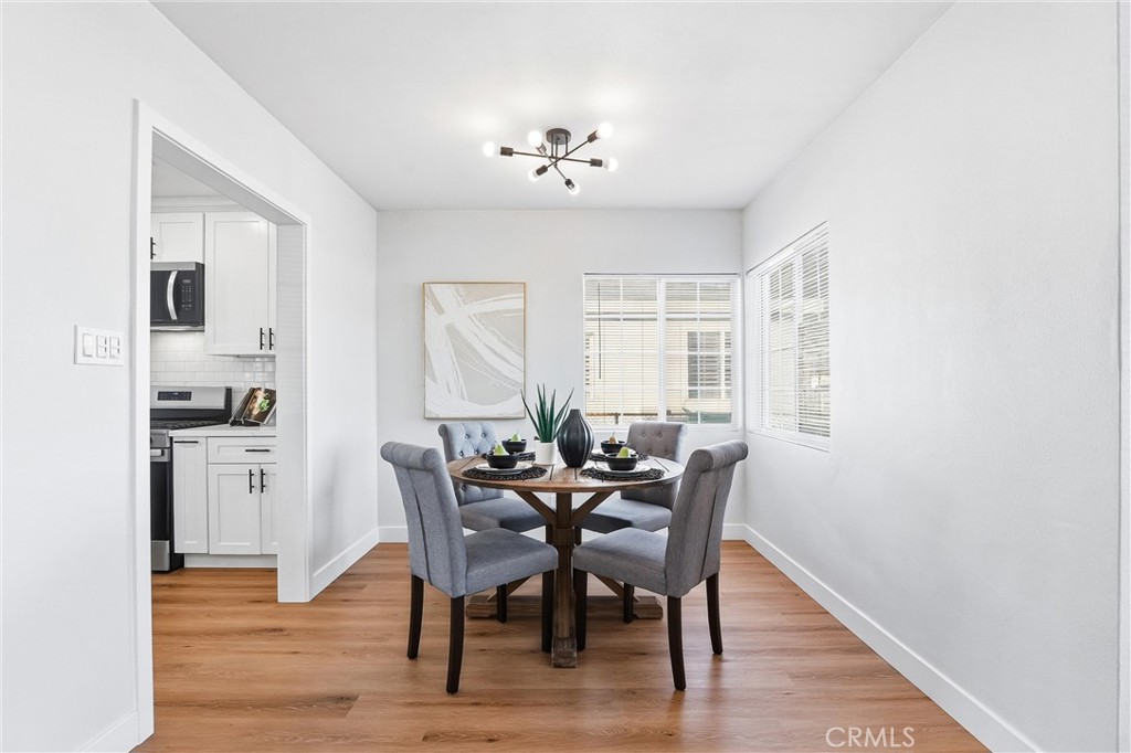 2835 Delta Avenue Long Beach, CA 90810 - Photo 8 of 29 a view of a dining room with furniture and chandelier