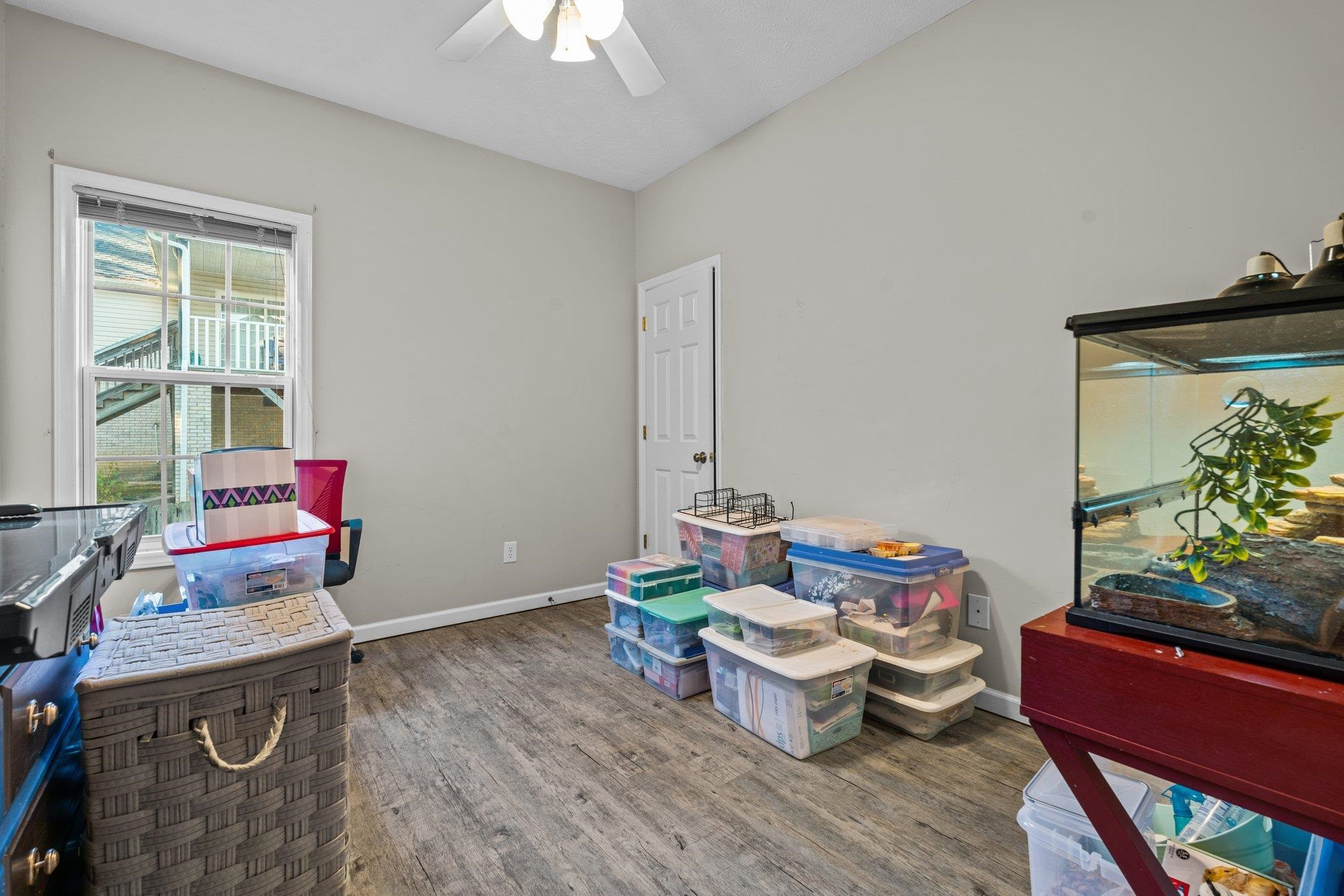 28 Commonwealth Court Cameron, NC 28326 - Photo 27 of 39 a living room with furniture and a potted plant
