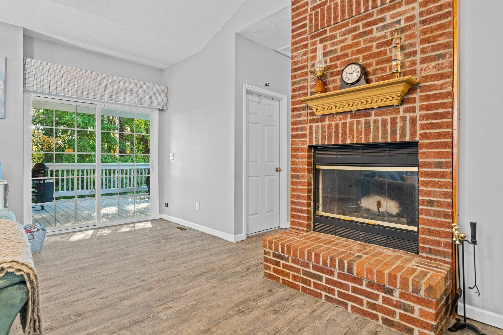28 Commonwealth Court Cameron, NC 28326 - Photo 5 of 39 a living room with a fireplace wooden floor and a fireplace