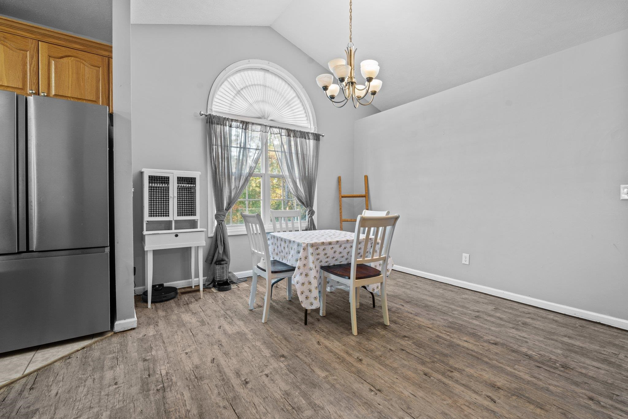 28 Commonwealth Court Cameron, NC 28326 - Photo 6 of 39 a dining room with furniture a chandelier and wooden floor