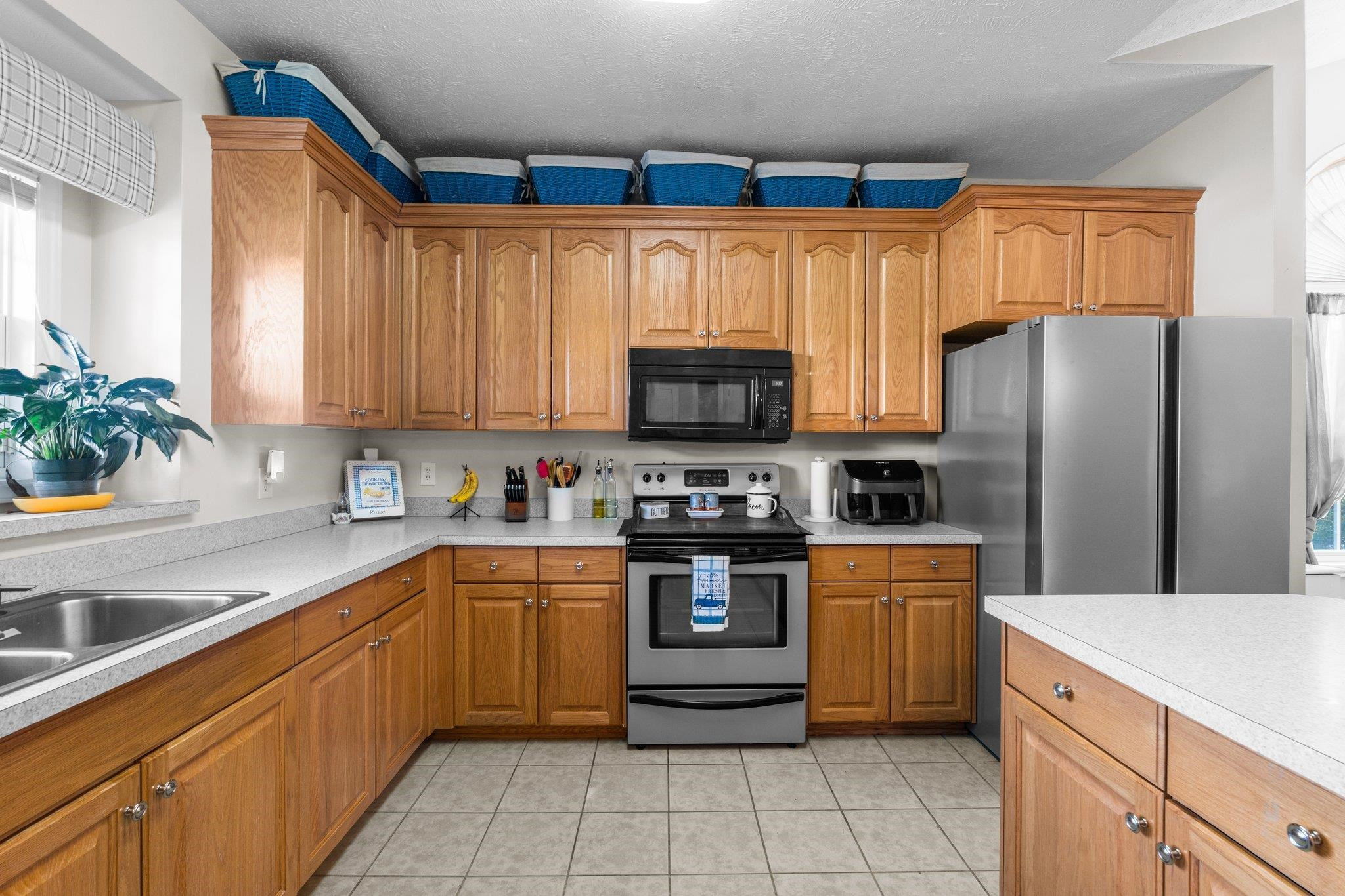 28 Commonwealth Court Cameron, NC 28326 - Photo 8 of 39 a kitchen with stainless steel appliances granite countertop a refrigerator sink and microwave