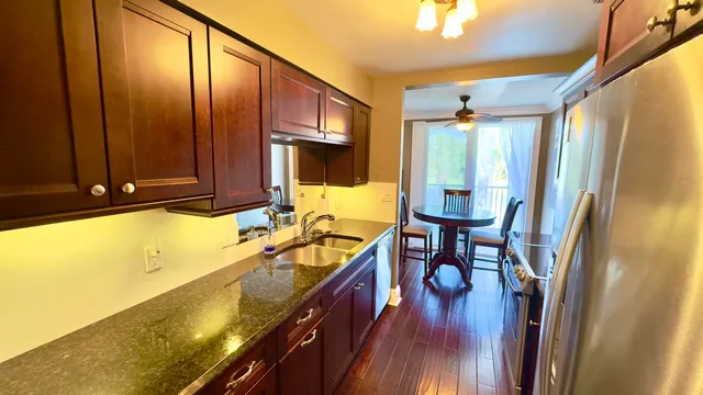 a bathroom with a sink mirror toilet and shower
