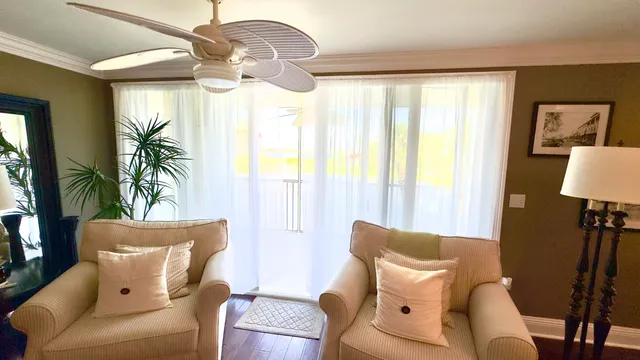 a bedroom with a bed and a flat tv screen on dresser