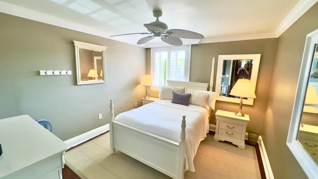 a view of a bedroom with washer and dryer