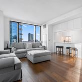a living room with furniture and a table