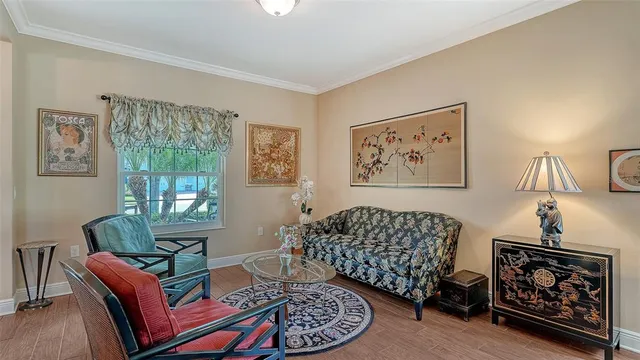 a living room with furniture a rug and a window