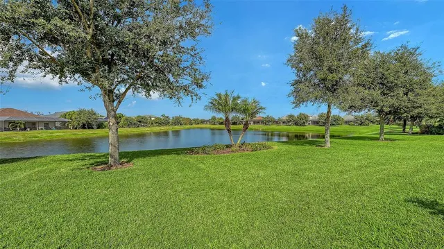 an aerial view of a house with a swimming pool