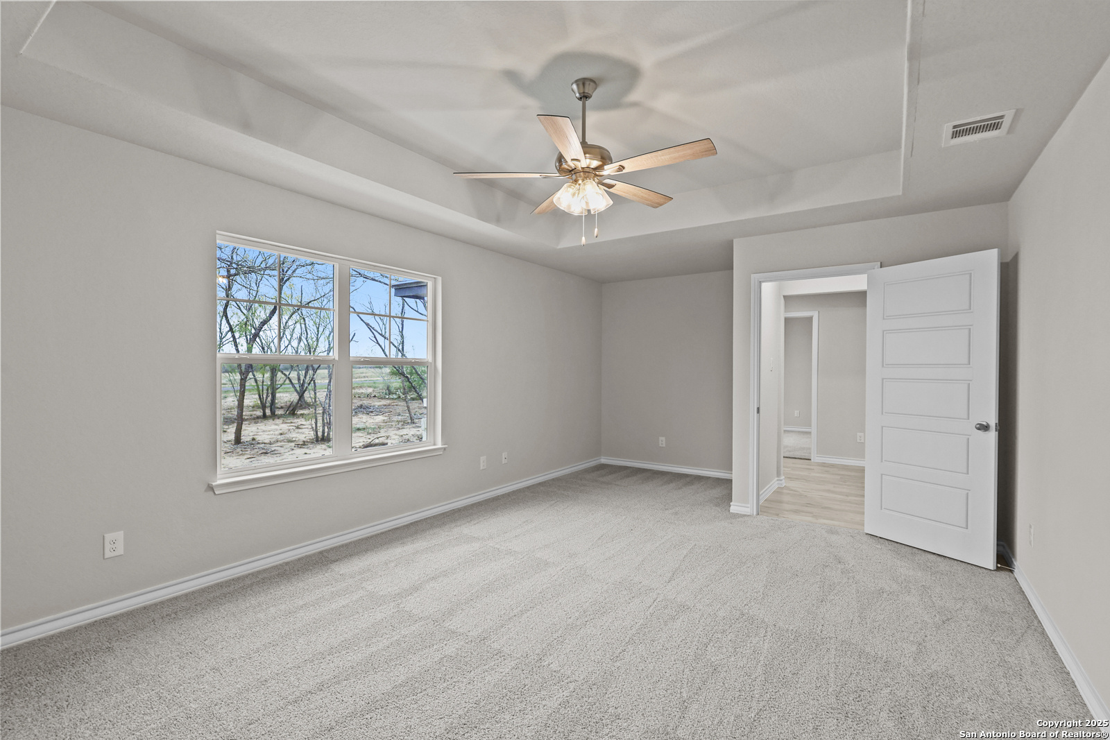 149 Sylas Hayes Loop Pleasanton, TX 78064 - Photo 19 of 38 a view of an empty room with a window