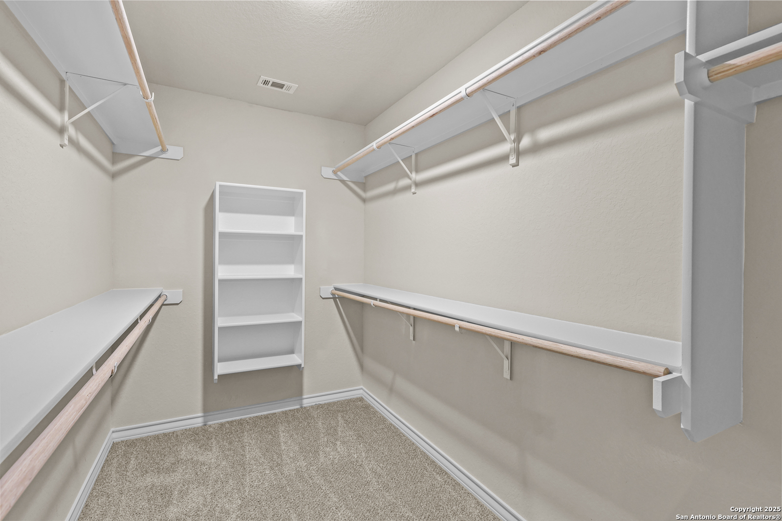 149 Sylas Hayes Loop Pleasanton, TX 78064 - Photo 23 of 38 a view of an empty walk in closet