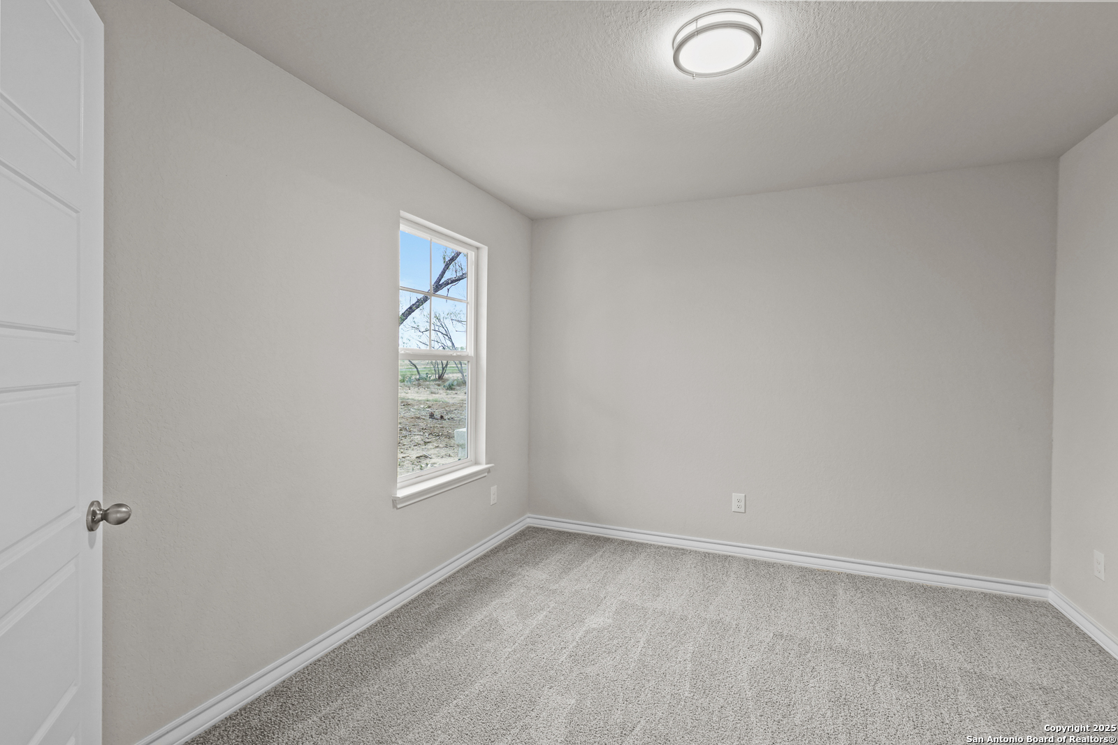 149 Sylas Hayes Loop Pleasanton, TX 78064 - Photo 24 of 38 a view of an empty room and window