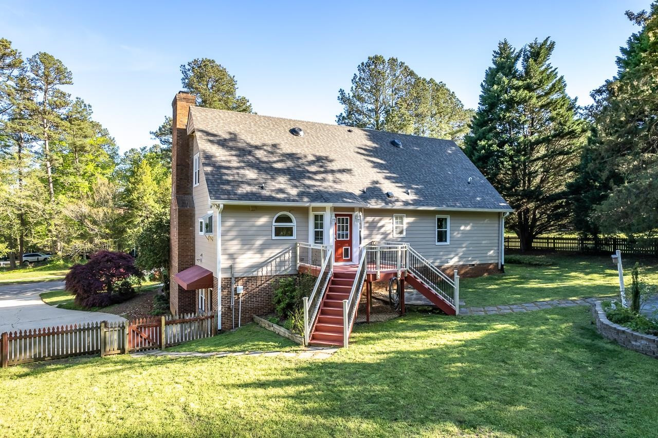 6345 Wynbrook Way Raleigh, NC 27612 - Photo 40 of 40 a view of a house with a yard patio and slide
